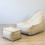linen bean bag with footstool on a wooden floor
