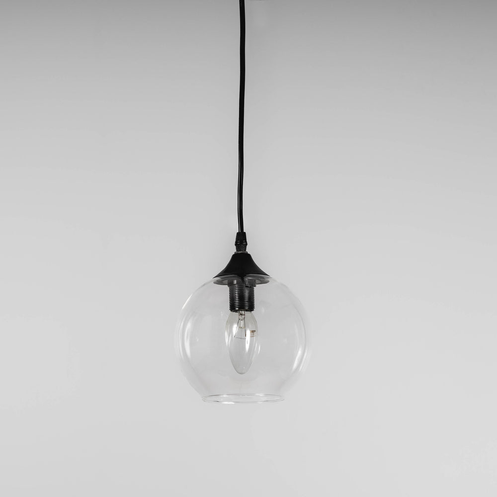 small glass pendant light with black hardware