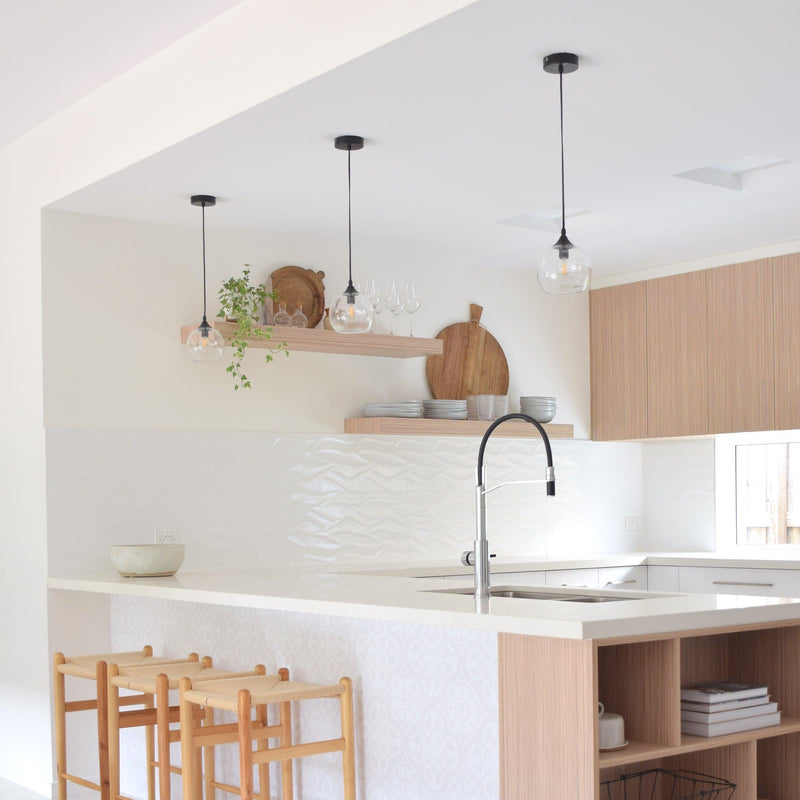 frankie glass pendant lights in a modern white kitchen with timber accents