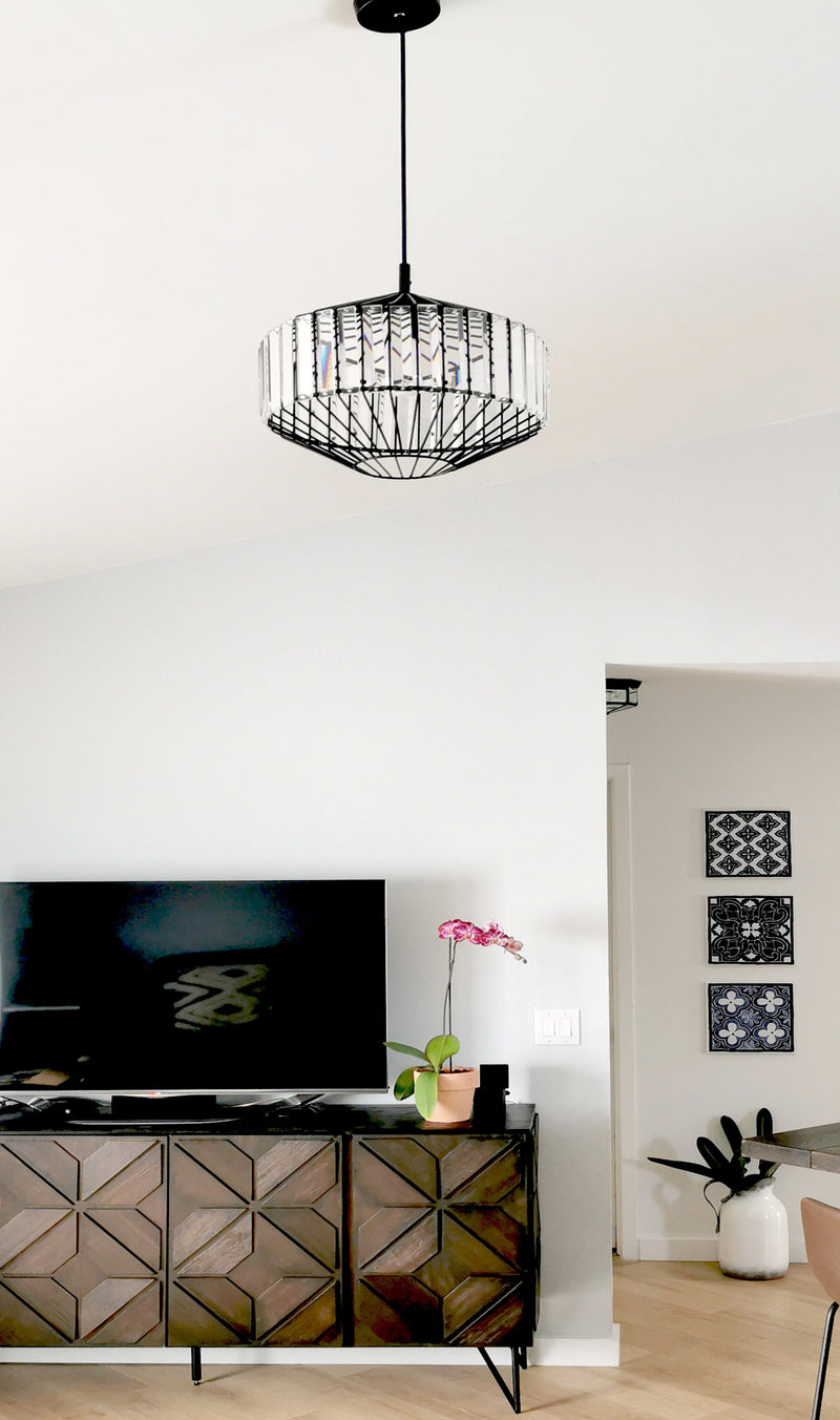 butler glass pendant light in a living room with timber console in the background