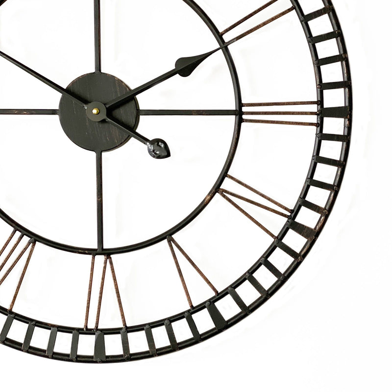 provincial look distressed metal wall clock on a white wall