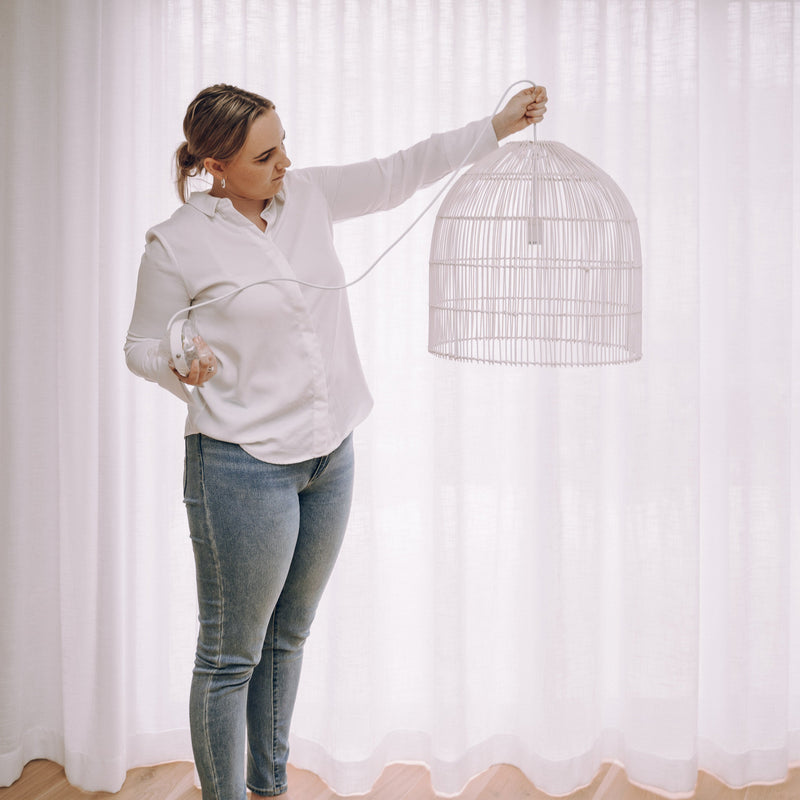 Woman holding rattan light