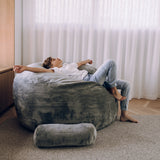 child laying in sensory foam filled beanbag