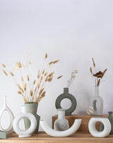 home decor modern ceramic vases on a wooden shelf