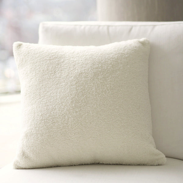 boucle cushion with insert on a white hampton chair