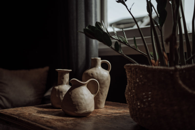 clay ceramic vase vessels on an old wooden table