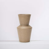 modern clay ceramic vase on a white shelf